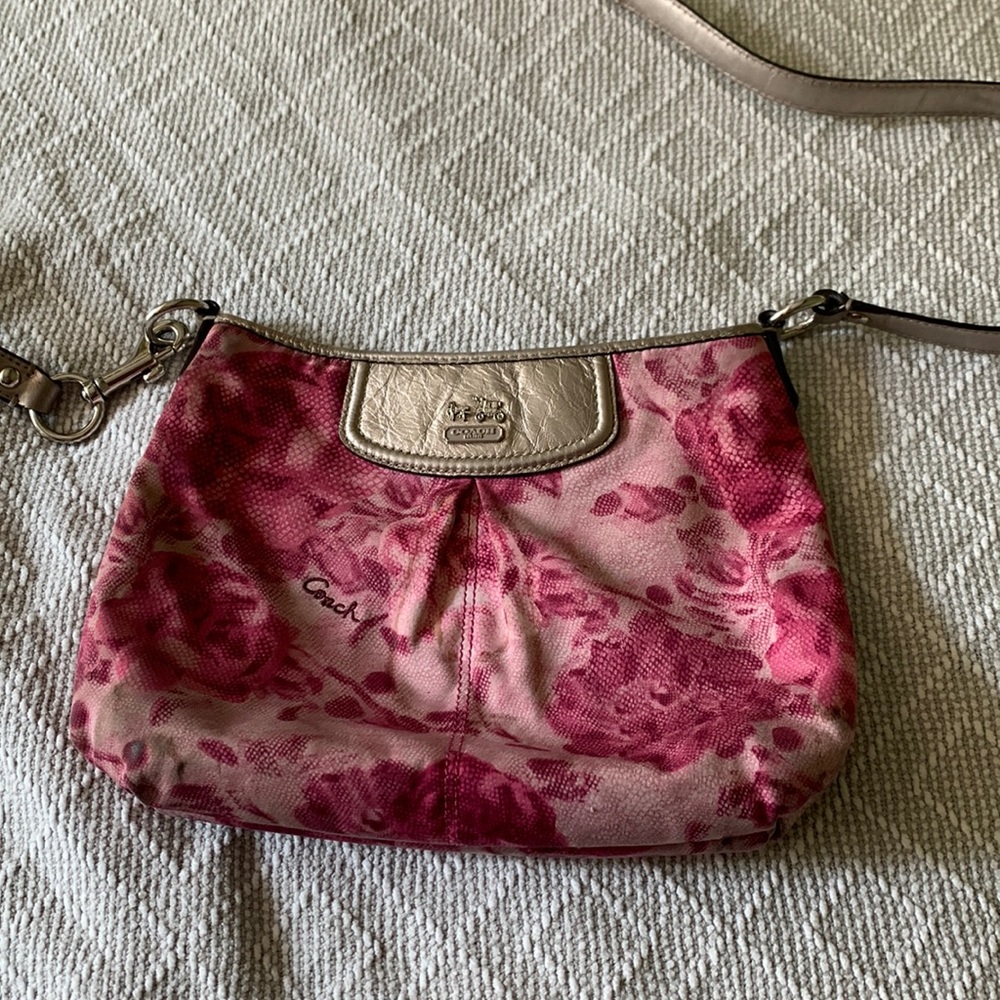 Pink Coach crossbody purse. Has some stains, pre loved, but still beautiful